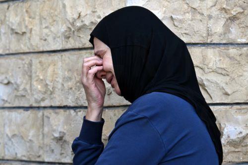 epa11707560 A woman mourns during a funeral of 16 people who were killed in an Israeli strike in the town of Barja, during the funeral in the southern port city of Tyre, Lebanon, 07 November 2024. At least 20 people were killed as a result of an Israeli airstrike on a residential building in Barja late on 05 November, the Lebanese Ministry of Health said....