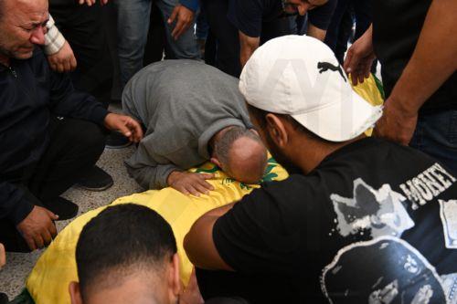 epa11707567 Mourners react over the coffin of one of the 16 people who were killed in an Israeli strike in the town of Barja, during the funeral in the southern port city of Tyre, Lebanon, 07 November 2024. At least 20 people were killed as a result of an Israeli airstrike on a residential building in Barja late on 05 November, the Lebanese Ministry of...