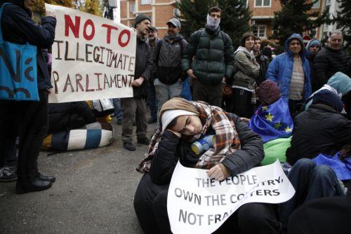 epa11739297 Supporters of Georgian opposition parties block the Georgian Parliament building to protest against the results of the parliamentary election, before first session of newly elected parliament in Tbilisi, Georgia, 25 November 2024. On 26 October parliamentary elections were held in Georgia. Around 20 parties competed for seats in the country's...