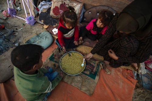 epa11745708 Members of the family of Palestinian man Wahbi Salama sit near their tent in the Khan Yunis camp in the southern Gaza Strip, 28 November 2024. Salama's family of six lives in a tent erected on the rubble of their home in an area destroyed by Israeli forces in Khan Yunis. According to the UN, at least 1.9 million people (or nine in ten people)...