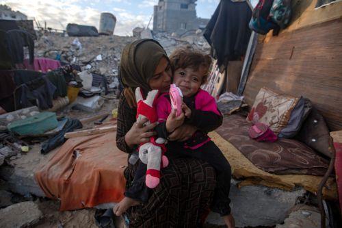 epa11745711 Members of the family of Palestinian man Wahbi Salama sit near their tent in the Khan Yunis camp in the southern Gaza Strip, 28 November 2024. Salama's family of six lives in a tent erected on the rubble of their home in an area destroyed by Israeli forces in Khan Yunis. According to the UN, at least 1.9 million people (or nine in ten people)...