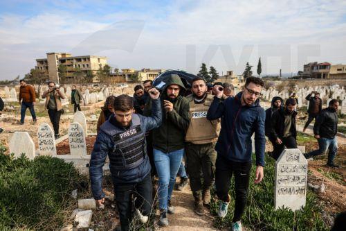 epa11756388 People carry the body of Syrian photojournalist Anas al-Kharboutli, who was killed in an airstrike, during his funeral procession in Idlib, Syria, 04 December 2024. Al-Kharboutli was killed on 04 December in an airstrike on Murk city, Hama countryside, while covering the ongoing fighting between opposition and government forces, according to the...