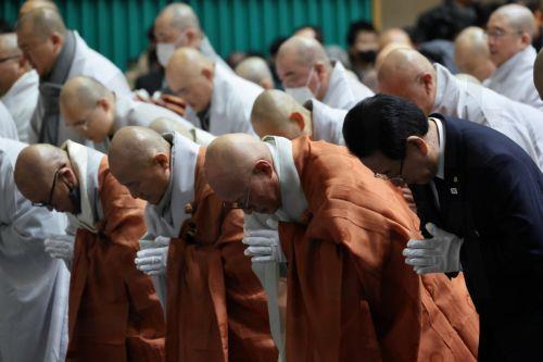 epa11798525 South Korean monks pay tribute to the victims of the 29 December Jeju Air plane crash at a joint memorial altar at Muan Sports Center in Muan, South Korea, 30 December 2024. According to the South Korea National Fire Agency (NFA), a passenger jet carrying 181 people erupted in flames after going off the runway at an airport in South Korea's...