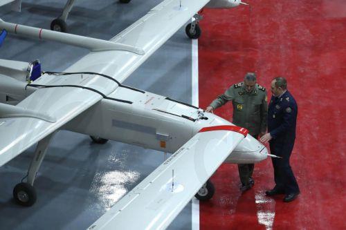 epa11821631 A handout picture made available by the Iranian army office shows Commander-in-Chief of Iran's Army, Abdolrahim Mousavi (L), and Iranian Defense Minister Aziz Nasirzadeh (R) inspecting the drones during an inauguration ceremony of 1000 new drones joining the Iranian Army in Tehran, Iran, 13 January 2025.  EPA/HANDOUT HANDOUT EDITORIAL USE...