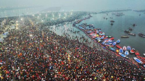 epa11821882 A handout photo taken by drone made available by the Uttar Pradesh State Information Department shows Hindu devotees gathering to take a 'holy bath' on the first day of the Kumbh Mela festival at Sangam, the confluence of the holy rivers Ganges, Yamuna and Saraswati, in Prayagraj, northern state of Uttar Pradesh, India, 13 January 2025. Hundreds...
