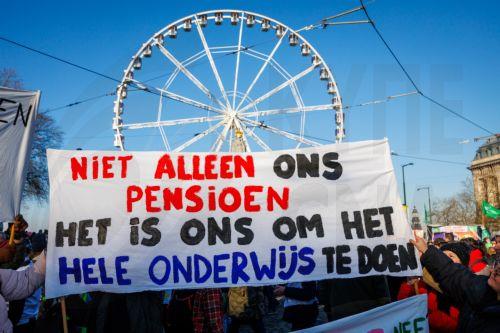 epa11821958 Demonstrators hold a banner reading 'We do not care about our pension alone, we support the education system' during the common union front demonstration as part of government negotiations on the subject of pensions in Brussels, Belgium, 13 January 2025. The demonstrators demand higher pensions, good employment conditions, shorter careers in...
