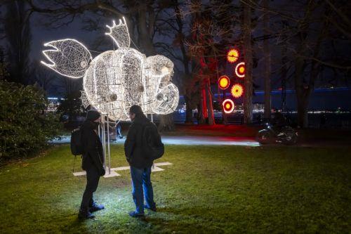 epa11829088 People look at a new project titled 'Animalux' by Christophe Kiss shown as part of the Geneva Lux Festival in Geneva, Switzerland, 16 January 2025. Geneva Lux festival at its 11th edition is a contemporary light show consisting of 24 light and decoration projects, created and scripted by Swiss and international artists, running from 17 January...