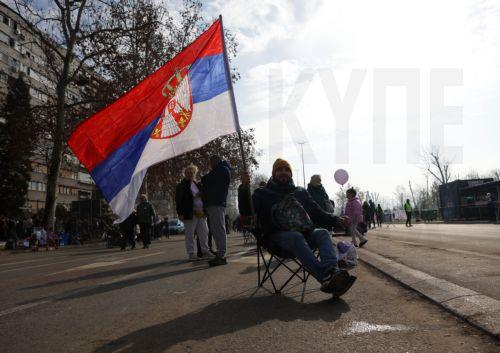 epa11869835 A protester takes part in the blockade of the 'Freedom bridge' (Most Slobode) in Novi Sad, Serbia, 02 February 2025. University students staged a protest on the three-month anniversary of the Novi Sad railway station collapse, demanding accountability for the tragedy that claimed 15 lives on 01 November 2024. The station, which had been...