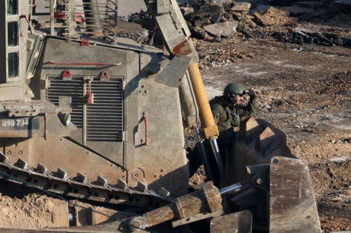 epaselect epa11869766 An Israeli soldier takes position next to a bulldozer during a military operation in the Al Farea refugee camp, near the West Bank city of Tubas, 02 February 2025. According to the Palestinian Ministry of Health over two dozen people have been killed in the West Bank since the start of Israeli military operations on 21 January 2025. ...