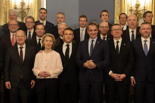 epa11886935 (L-R) German Chancellor Olaf Scholz, European Commission President Ursula von der Leyen, French President Emmanuel Macron, Greek Prime Minister Kyriakos Mitsotakis, and other European leaders pose for a group photo during a meeting as part of the Artificial Intelligence (AI) Action Summit at the Elysee in Paris, France, 10 February 2025. The...