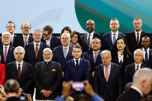 epa11888485 French President Emmanuel Macron (C), Indian Prime Minister Narendra Modi (2-L) and UN Secretary-General Antonio Guterres (2-R) pose for a family photo with participants at the end of a plenary session during the Artificial Intelligence (AI) Action Summit at the Grand Palais in Paris, France, 11 February 2025. The summit takes place from 10 to...