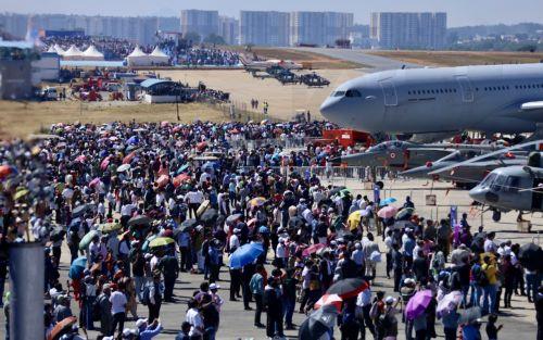 epa11890763 People attend the 15th 'Aero India' air show at the Yelahanka Air Force Station in Bangalore, India, 12 February 2025. The air show and aviation exhibition gathers more than 800 global exhibitors and runs from 10 to 14 February 2025.  EPA/JAGADEESH NV