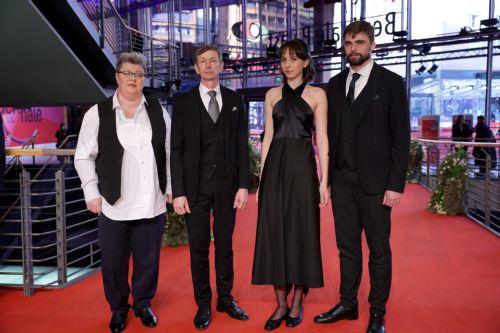 epa11910258 Olha Bryhynets (2-R), Borys Khovriak (R) and guests arrive for the screening of 'Strichka Chasu (Timestamp)' during the 75th Berlin International Film Festival, in Berlin, Germany, 20 February 2025. The Berlinale runs from 13 to 23 February 2025.  EPA/CHRISTOPHER NEUNDORF