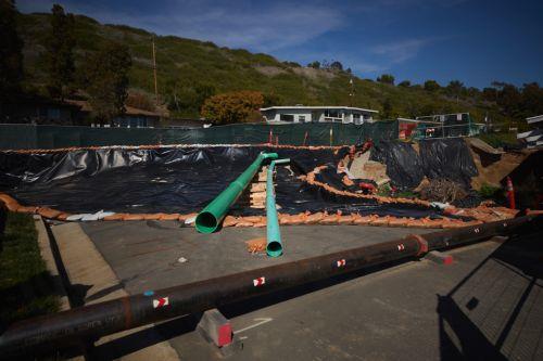 epa11984927 Various utility pipes are moved above ground due to land movement in Rancho Palos Verdes, California, USA, 23 March 2025. The Palos Verdes Peninsula has been seeing a decades-long, slow-moving landslide that is pulling apart structures, cutting gas and power lines, and severing roads. According to NASA, the large amount of rainfall from storms...