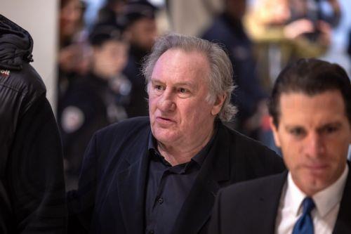 epa11989008 French actor Gerard Depardieu (C), flanked by his lawyer Jeremie Assous (R), arrives at the Paris Courthouse for the third day of his trial in Paris, France, 26 March 2025. Depardieu stands trial over charges of sexual assault against two women on the set of the film 'Les Volets Verts' in 2021.  EPA/CHRISTOPHE PETIT TESSON