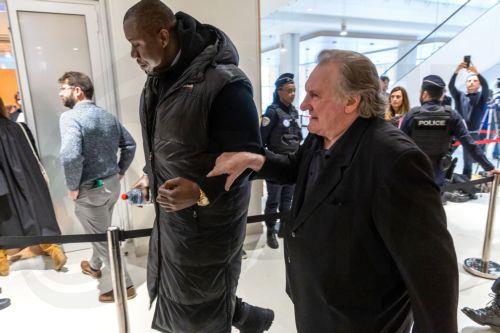 epa11989067 French actor Gerard Depardieu (R) returns to court during the third day of his trial at the Paris Courthouse, in Paris, France, 26 March 2025. Depardieu stands trial over charges of sexual assault against two women on the set of the film 'Les Volets Verts' in 2021.  EPA/CHRISTOPHE PETIT TESSON