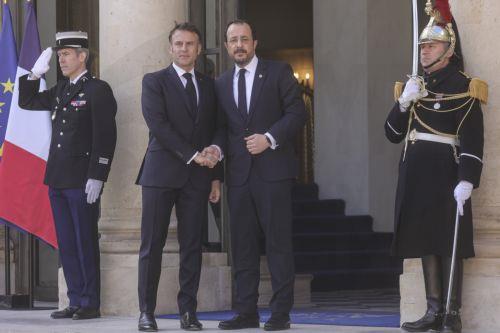 epa11991328 French President Emmanuel Macron (L) greets Cyprus President Nikos Christodoulides (R) upon his arrival for the 'Coalition of the Willing' summit on peace and security for Ukraine, with European and international leaders, at the Elysee Palace in Paris, France, 27 March 2025.  EPA/Teresa Suarez