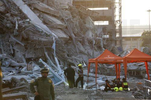 epa11994304 Rescue workers search for survivors at the site of a collapsed building following an earthquake in Bangkok, Thailand, 28 March 2025. According to the National Institute for Emergency Medicine, 70 construction workers are missing at the site following a 7.7-magnitude earthquake that struck Myanmar and caused tremors that could be felt in...