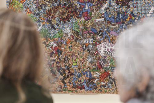 epa12004917 People observe the painting The Beast of the Apocalypse by French artist Agathe PitiÃ©, displayed at the French gallery Claude Bernard stand during the Art Paris fair at the Grand Palais in Paris, France, 02 April 2025. The modern and contemporary fair Art Paris runs from 03 to 06 April 2025 and hosts 170 galleries from 25 countries around the...