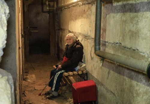 epa12008775 An elderly Ukrainian woman sits in a basement at the site of a drone attack in Kharkiv, Ukraine, late 03 April 2025 (issued 04 April 2025), amid the ongoing Russian invasion. At least four people died and 35 other people were injured, including one child, according to the State Emergency Service.  EPA/SERGEY KOZLOV
