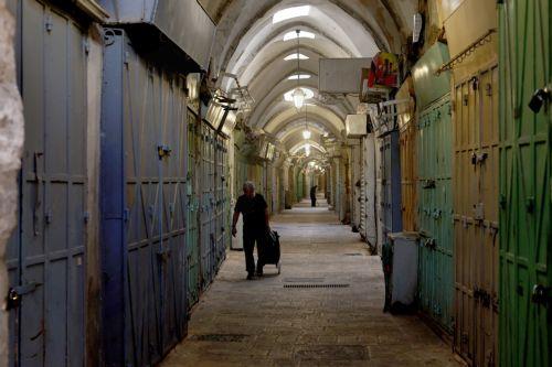 epa12015161 A Palestinian man walks in the alleys of the old city of Jerusalem, 07 April 2025, during a general strike in the Palestinian territories in solidarity with Gaza. More than 50,500 Palestinians have been killed in the Gaza Strip, according to the Palestinian Ministry of Health, since Israel launched a military campaign in the strip in response to...