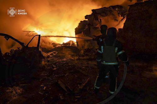 epa12022165 A handout photo made available by the State Emergency Service of Ukraine shows rescuers working at the site of a drone-hit private building in Kyiv, Ukraine, 10 April 2025, amid the ongoing Russian invasion. At least two people were injured after overnight Russian shelling in Kyiv's area, according to the State Emergency Service report. Russian...