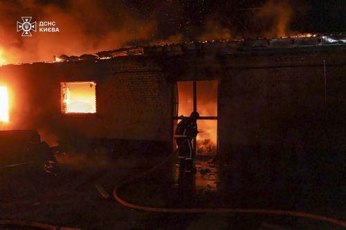 epa12022166 A handout photo made available by the State Emergency Service of Ukraine shows rescuers working at the site of a drone-hit private building in Kyiv, Ukraine, 10 April 2025, amid the ongoing Russian invasion. At least two people were injured after overnight Russian shelling in Kyiv's area, according to the State Emergency Service report. Russian...