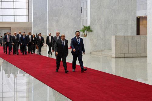 epa12031664 Syrian Foreign Minister Asaad al-Shaibani (R) welcomes Lebanese Prime Minister Nawaf Salam (L) in Damascus, Syria, 14 April 2025. Salam is visiting Damascus as the first senior official since the new Lebanese government was formed in February.  EPA/MOHAMMED AL-RIFAI