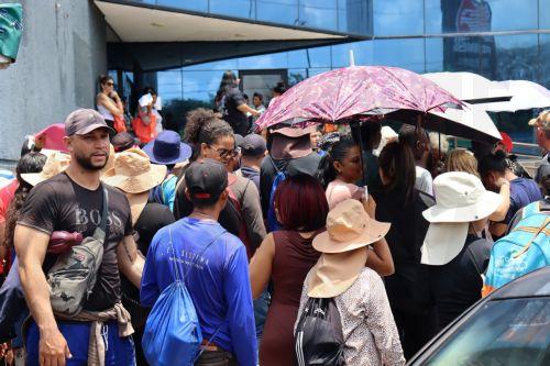 epa12045787 Migrants wait in line to receive monetary assistance in Tapachula, in Chiapas, Mexico, 21 April 2025. Migrants on the Mexico-Guatemala border want to work on the Mayan Train, the Interoceanic Corridor and the industries promised by Mexican President Claudia Sheinbaum to mitigate migration, which would strengthen the area as an industrial hub in...