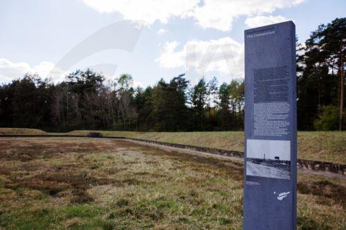 epa12057287 A stele displays information beside the remains of the crematorium on the grounds of the former concentration camp Bergen-Belsen ahead of the 80th anniversary of its liberation in Lohheide, Germany, 26 April 2025. Bergen-Belsen, initially established as a prisoner-of-war camp, became a concentration camp in 1943, where more than 52,000 prisoners...