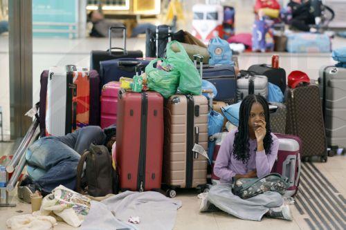 epa12061842 People wait at Sants station for the resumption of the train services due to a disruption in the regional train schedule following an electrical blackout in Spain and Portugal, in Barcelona, Spain, 29 April 2025. A power blackout hit large parts of Spain and spread to neighboring Portugal and France on 28 April, disrupting transport systems,...
