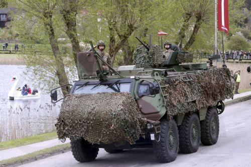 epa12072776 Members of the Latvian Army attend the Latvian Independence Restoration Day military parade in Talsi, Latvia, 04 May 2025. The day marks a national holiday celebrated annually with the traditional military parade taking place in a different regional center since 2013.  EPA/TOMS KALNINS
