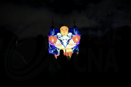 epa12085040 People look at a projection on the National Gallery for Foreign Art during the Lunar Festival of Lights in Sofia, Bulgaria, 08 May 2025. The fourth edition of the LUNAR Festival of Lights will be held over four evenings, from 08 to 11 May. The event will feature 3D projection mapping, light installations, and artists from around the world. ...