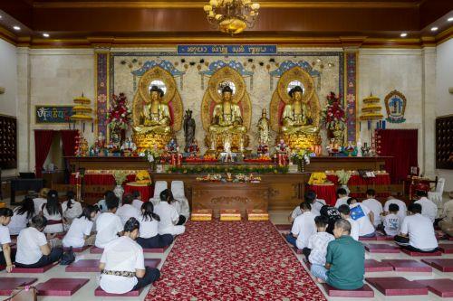 epa12092958 People take part in Vesak Day or Buddha's Birthday, celebrations at a temple in Denpasar, Bali, Indonesia, 12 May 2025. Buddhists celebrate Vesak Day to mark the date of the birth, enlightenment, and passing of Gautama Buddha (Siddhartha Gautama).  EPA/MADE NAGI