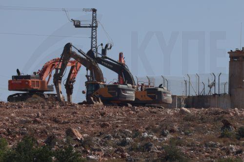 epaselect epa12127496 Israeli bulldozers near the West Bank village of Bruqin, west of Salfit, 23 May 2025. The Palestinian news agency Wafa reported that Israeli bulldozers have been levelling vast stretches of lands on the outskirts of Bruqin and Kafr ad-Dik villages. The land clearing is aimed at constructing roads and spaces to serve Israeli settlers. ...