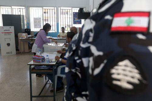 epa12129980 A Lebanese woman casts her ballot during the municipal elections at a polling station in Nabatieh, South Lebanon, 24 May 2025. The final phase of the Lebanese municipal elections is being held on 24 May after they were postponed in 2023 due to the financial and economic crisis the country is going through, and the lack of enough funding to hold...