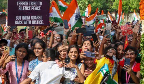 epa12136242 A handout photo made available by the press information bureau shows people attending a rally as Indian Prime Minister Narendra Modi visits in Vadodara, Gujarat, India, 26 May 2025. Modi is on a two-day visit to lay the foundation for several developmental projects to his home state, Gujarat. It is his first visit to the state following...