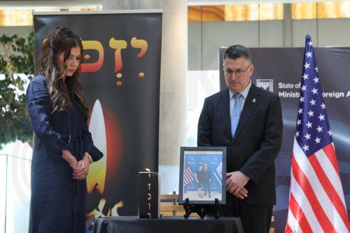 epa12136282 US Secretary of Homeland Security Kristi Noem (L) and Israeli Foreign Minister Gideon Sa'ar attend a memorial ceremony for two Israeli embassy staffers killed in Washington, at the Foreign Ministry in Jerusalem, 26 May 2025. The couple was shot dead outside the Jewish museum in Washington, D.C, on 21 May by a man who was later arrested and...