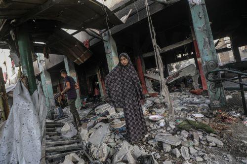 epa12136552 An internally displaced Palestinian woman stands among the rubble of her destroyed family shelter following Israeli airstrike in Al Jerjawi school in the Al Daraj neighborhood in Gaza City on 26 May 2025. According to the Palestinian Health Ministry in Gaza over 30 Palestinians were killed in the airstrike in the early hours of the morning. More...