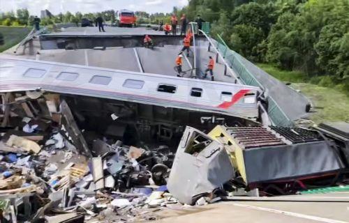 epa12148844 A handout still image taken from handout video provided by Russian Emergencies Ministry press-service shows Russian rescuers working at the site after a bridge collapsed on a passenger train in the Vygonichsky district, Bryansk region, Russia, 01 June 2025. According to Bryansk region governor, Alexander Bogomaz, at least seven people died in...