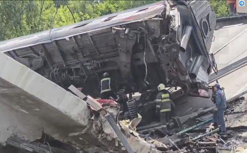 epa12149212 A still image taken from a handout video made available by the Russian Emergencies Ministry shows rescuers working at the site after a bridge collapsed on a passenger train in the Vygonichsky district, Bryansk region, Russia, 01 June 2025. According to Bryansk region governor, Alexander Bogomaz, at least seven people died in the incident, with...