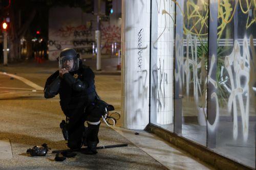 epa12167480 A police officer puts on riot gear during protests in Los Angeles, California, USA, 09 June 2025. The US president on 09 June mobilized Marines and additional National Guard troops amid large protests against ongoing immigration enforcement raids in the Los Angeles area, despite not receiving a request from the state of California for any...