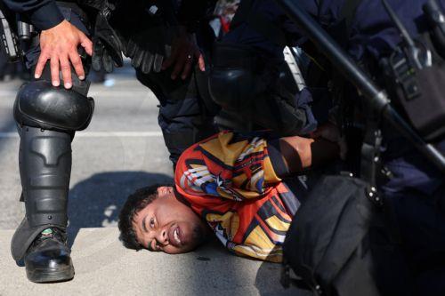 epaselect epa12169355 A protestor is arrested during protests sparked by immigration raids in Los Angeles, California, USA, 10 June 2025. Approximately 2,000 National Guard troops were deployed on 08 June in Los Angeles by US President Donald Trump, though the state of California had not requested any additional assistance, and protests have continued...