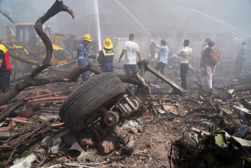 epa12171316 Debris at the site of a plane crash near Sardar Vallabhbhai Patel International Airport in Ahmedabad, Gujarat, western India, 12 June 2025. Air India flight AI171, bound for London carrying 242 passengers and crew members on board a Boeing 787-8 aircraft, crashed minutes after take-off in the Meghaninagar area of Ahmedabad.  EPA/SIDDHARAJ SOLANKI