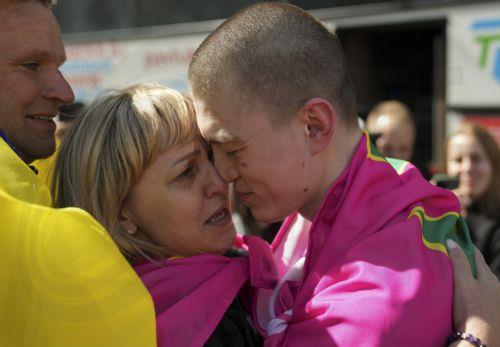 epa12171803 Relatives and friends of Ukrainian prisoners of war (POWs) welcome their loved ones following a prisoner swap at an undisclosed location in Ukraine, 12 June 2025. This is the second stage of the return of seriously wounded and seriously ill soldiers, Ukrainian President Volodymyr Zelensky wrote in his official Telegram channel. The agreement on...
