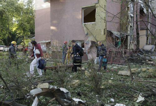 epa12192193 Residents evacuate the site of a rocket strike on a five-storey residential building, after a massive overnight attack on Kyiv, Ukraine, 23 June 2025, amid the ongoing Russian invasion. Russian strikes targeted residential buildings, educational institutions, sports facilities, a business center, and cars in the six districts of Kyiv. At least...