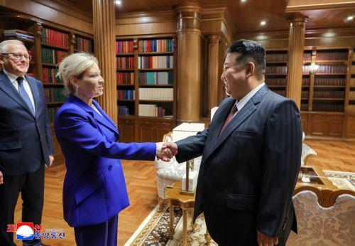 epa12205625 A photo released by the official North Korean Central News Agency (KCNA) shows Russian Culture Minister Olga Lyubimova (2-L) shaking hands with North Korean leader Kim Jong Un during their meeting at the headquarters of the Party Central Committee in Pyongyang, North Korea, 29 June 2025 (issued 30 June 2025). According to KCNA, Lyubimova is...