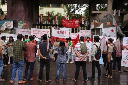 epa12226203 Left union activists shout against the central government during a nationwide strike in Kolkata, eastern India, 09 July 2025. The nationwide strike was organized by 10 trade unions in protest against four labour laws.  EPA/PIYAL ADHIKARY