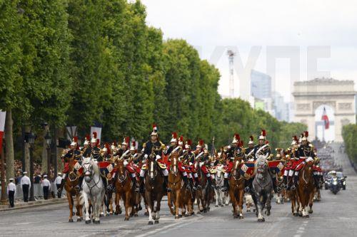 epa12237075 French cavalry arrives to the annual Bastille Day military parade during the Bastille day celebrations in Paris, France, 14 July 2025. France celebrates its national holiday, or Bastille Day, annually on 14 July to commemorate the storming of the Bastille fortress in 1789.  EPA/Mohammed Badra