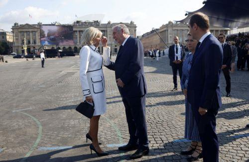epa12237076 Brigitte Macron (L) and French Prime Minister Francois Bayrou (R) arrive to the annual Bastille Day military parade during the Bastille day celebrations in Paris, France, 14 July 2025. France celebrates its national holiday, or Bastille Day, annually on 14 July to commemorate the storming of the Bastille fortress in 1789.  EPA/Mohammed Badra